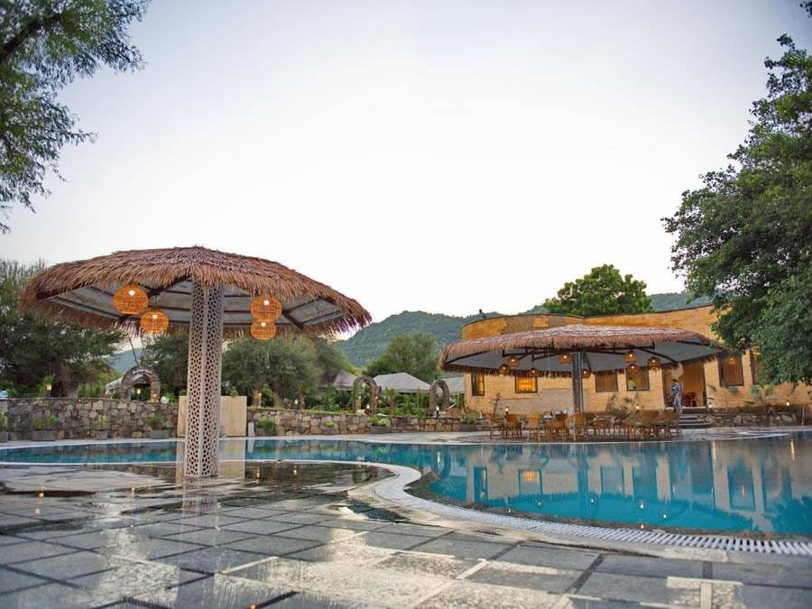 Poolside seating with hill views